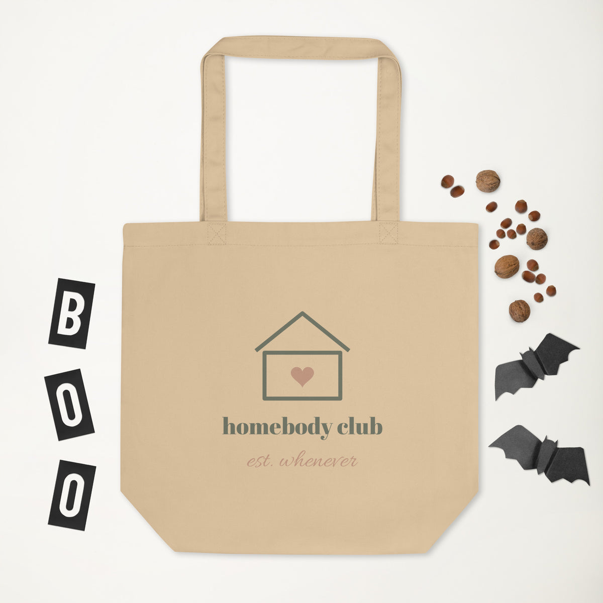 Homebody Club Tote in natural oyster, laid flat with a few small props