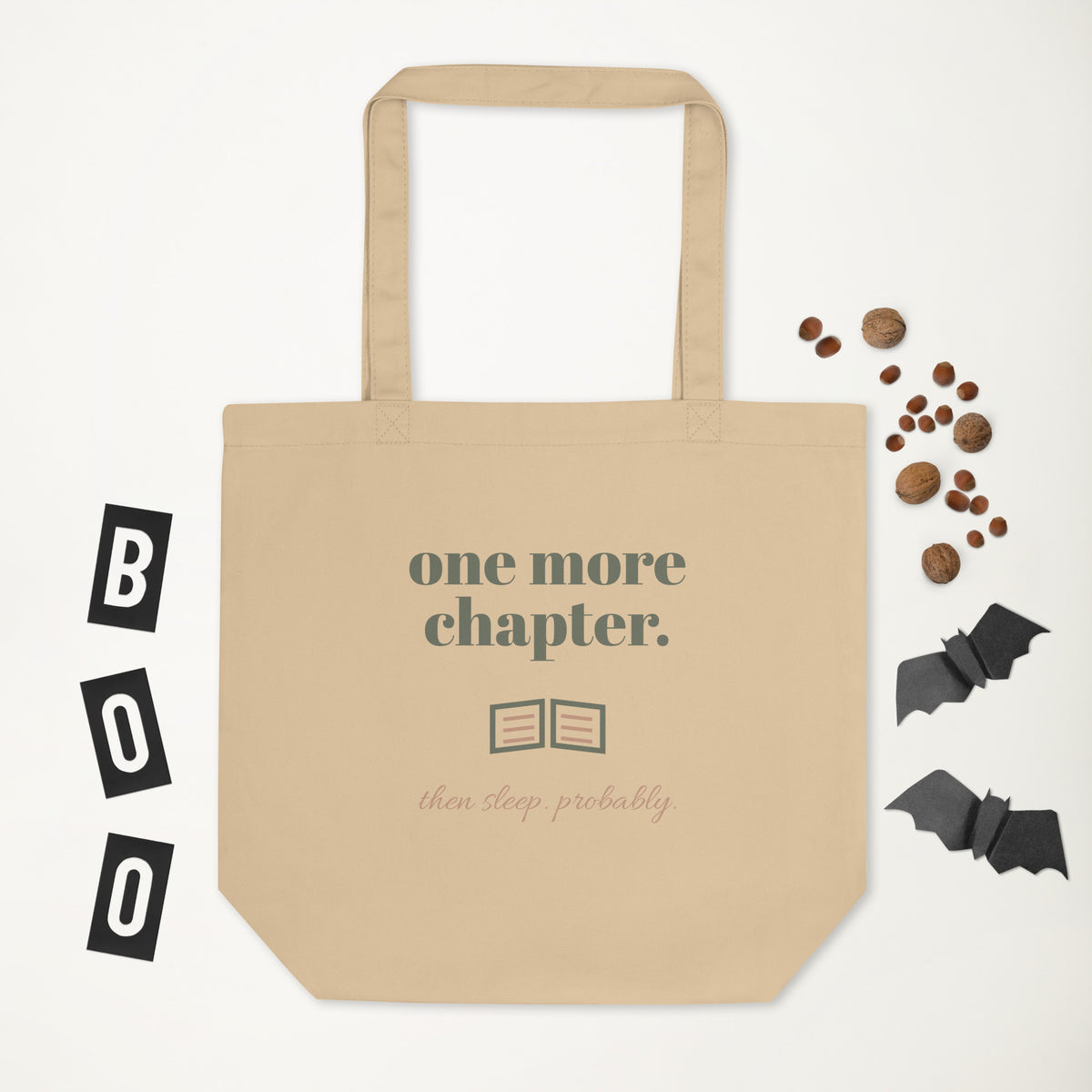 One More Chapter Tote in natural oyster, laid flat with a few small props