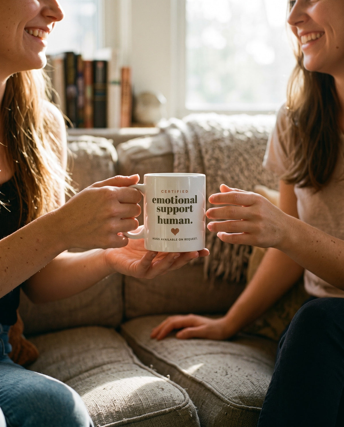 Emotional Support Human Mug, passed between friends on a sofa