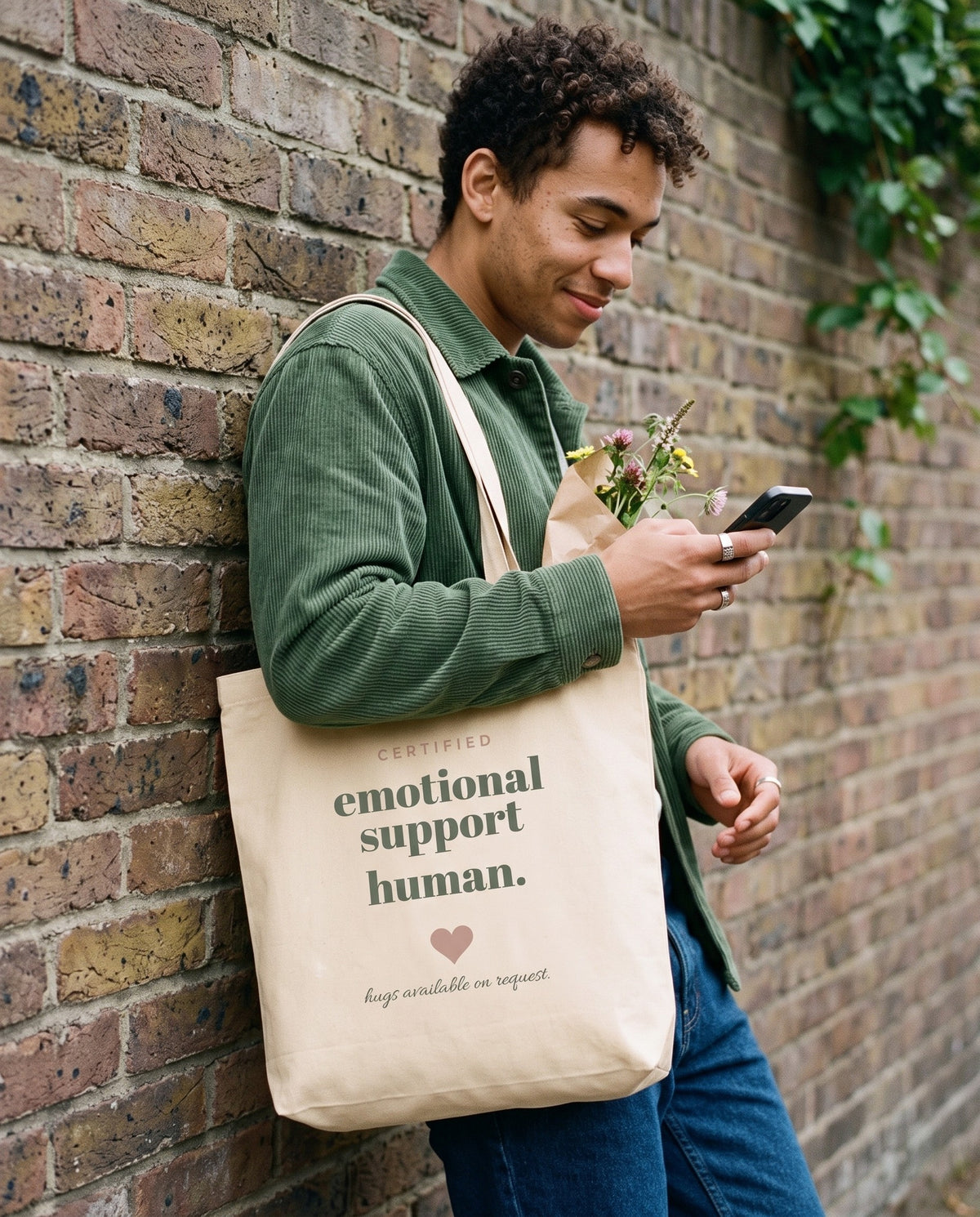 Emotional Support Human Tote, carried on a city street