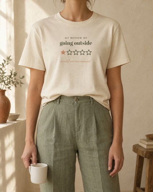 Going Outside, One Star Tee, in soft cream, worn with sage linen trousers