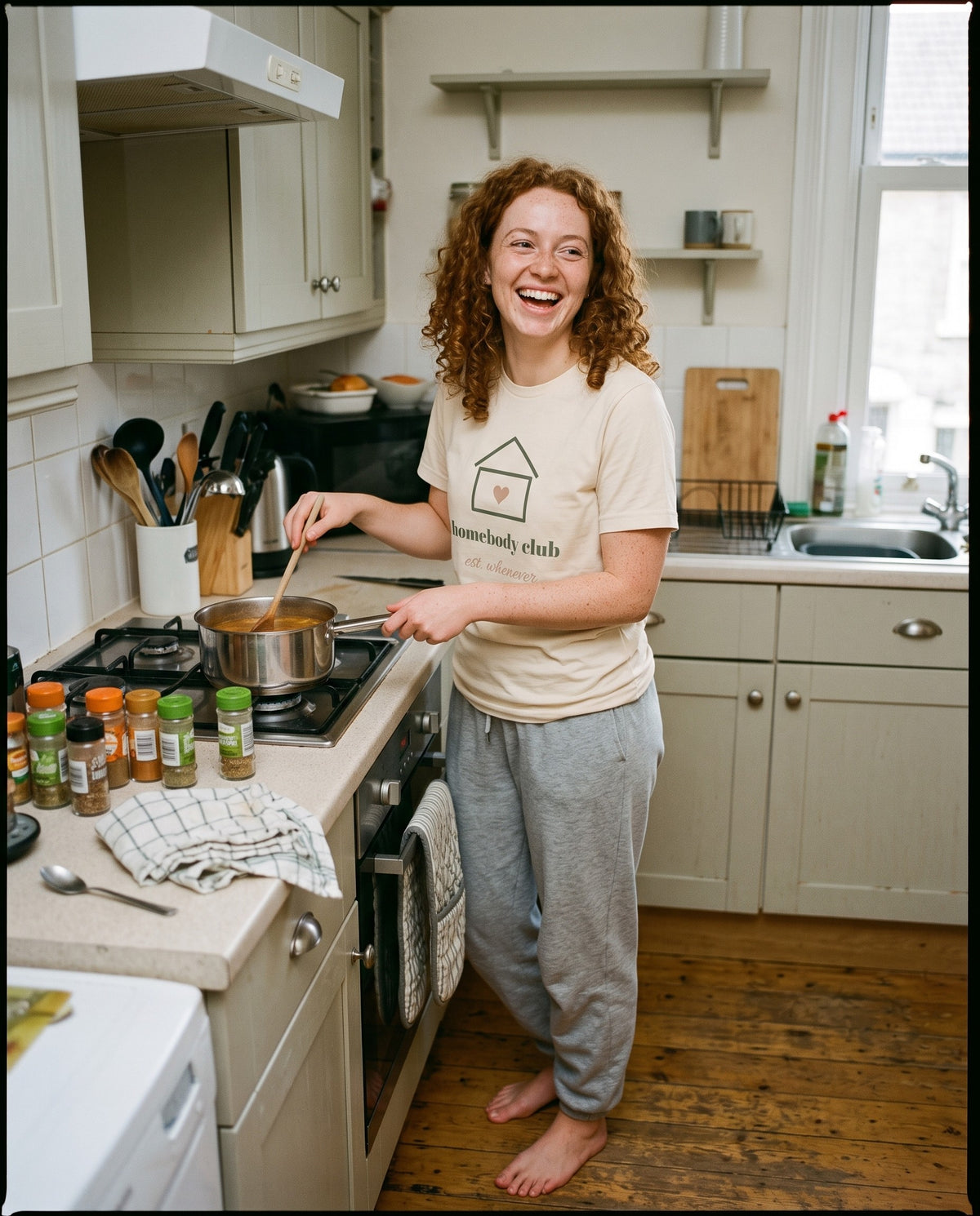 Homebody Club Tee, worn while cooking soup at home