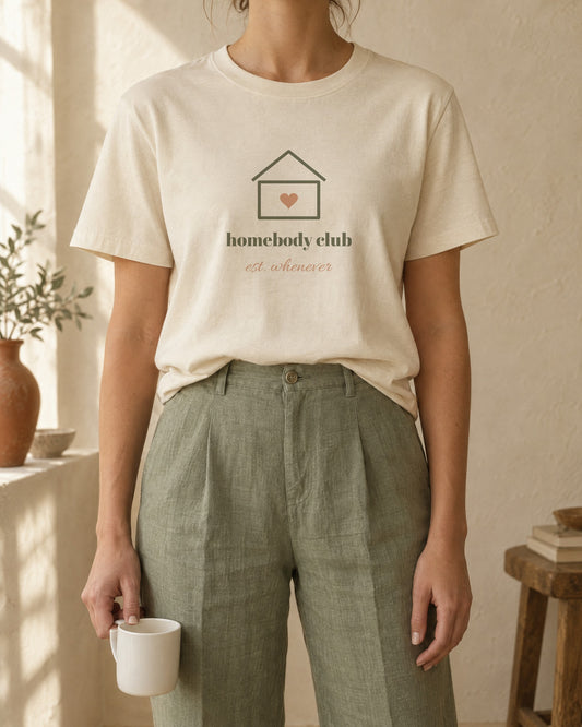 Homebody Club Tee, in soft cream, worn with sage linen trousers