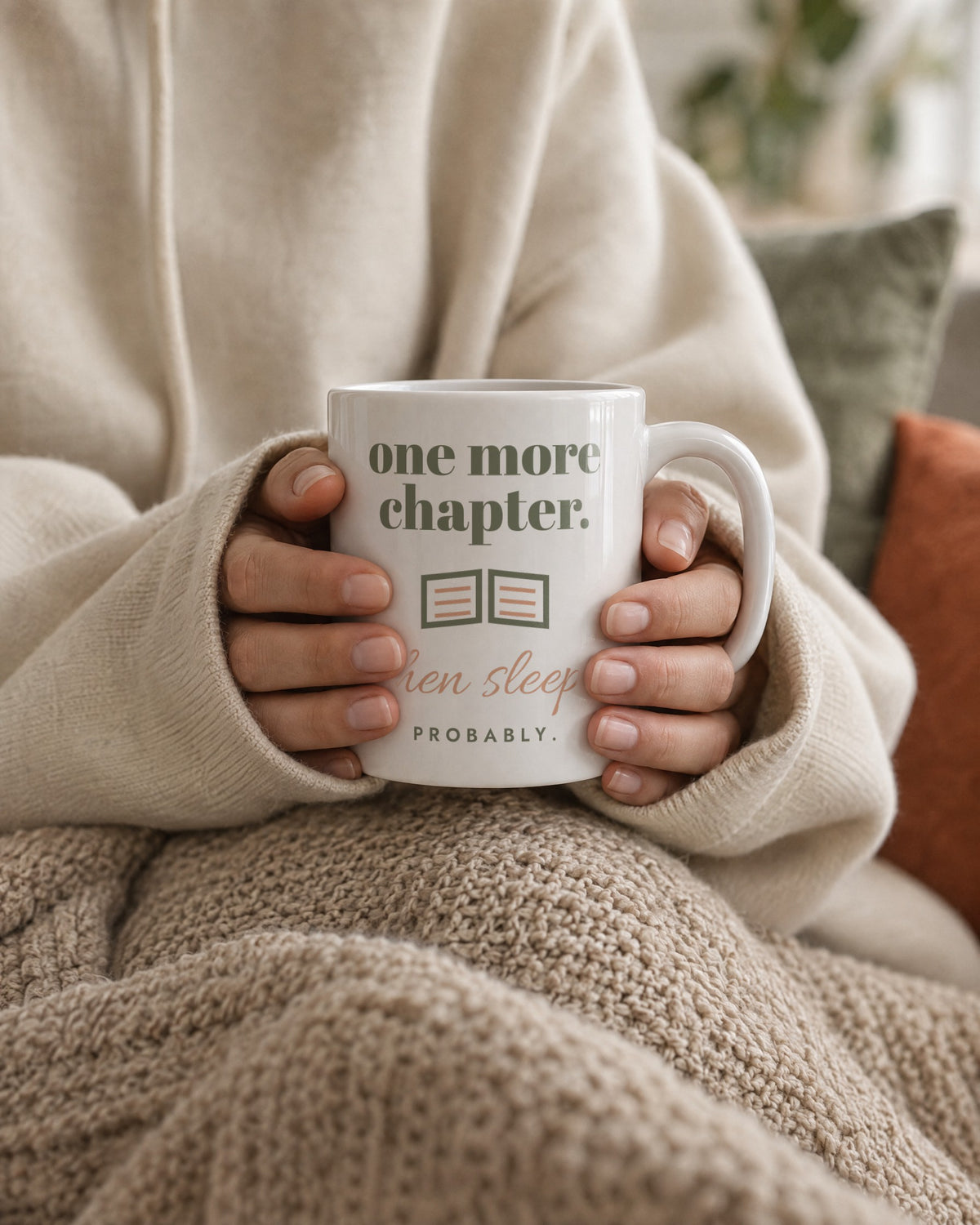 One More Chapter Mug, white ceramic 11 oz, held in two hands