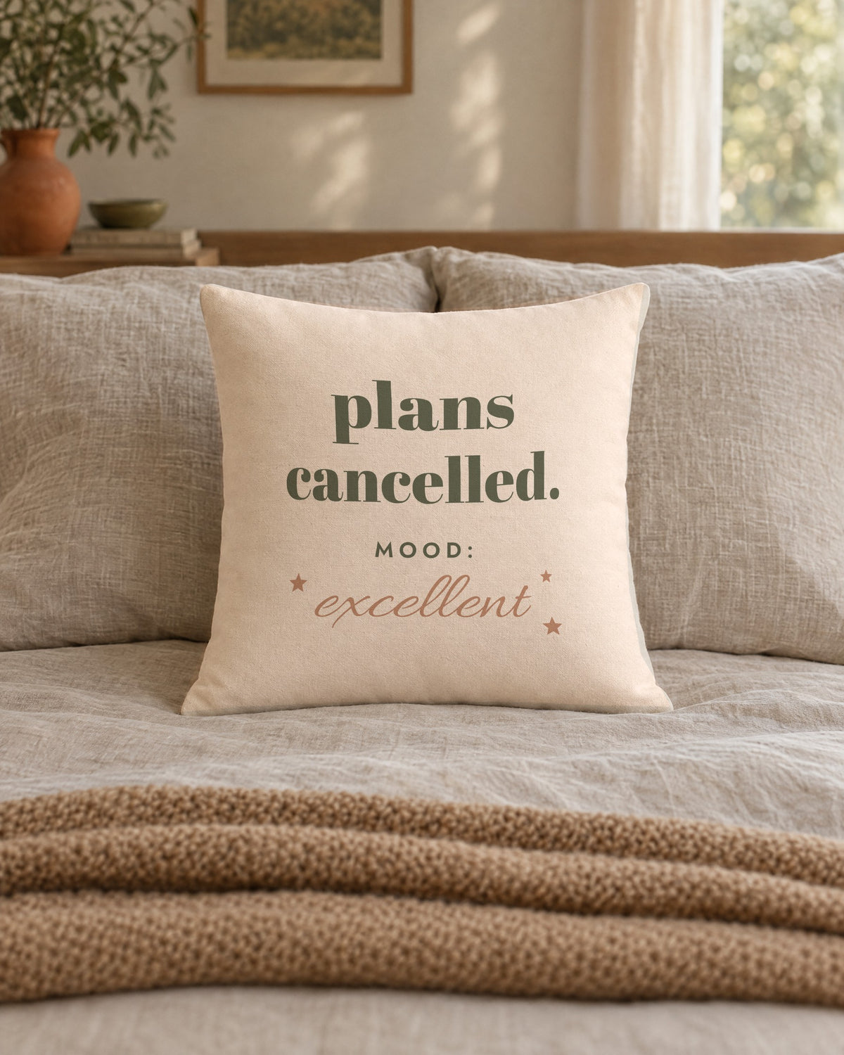 Plans Cancelled Pillow, 18 x 18 in, on a made bed