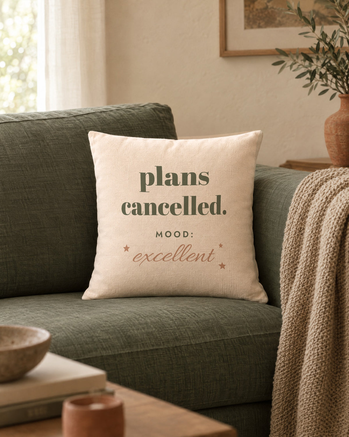 Plans Cancelled Pillow, 18 x 18 in, on a sage linen sofa
