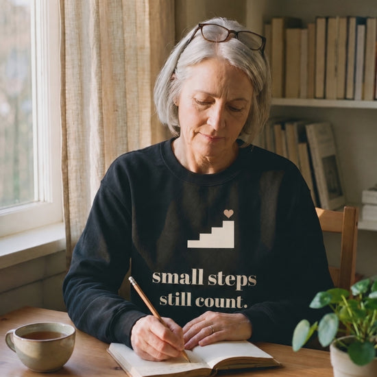 Small Steps Still Count Crewneck, a short clip of a pause to look out of the window while writing