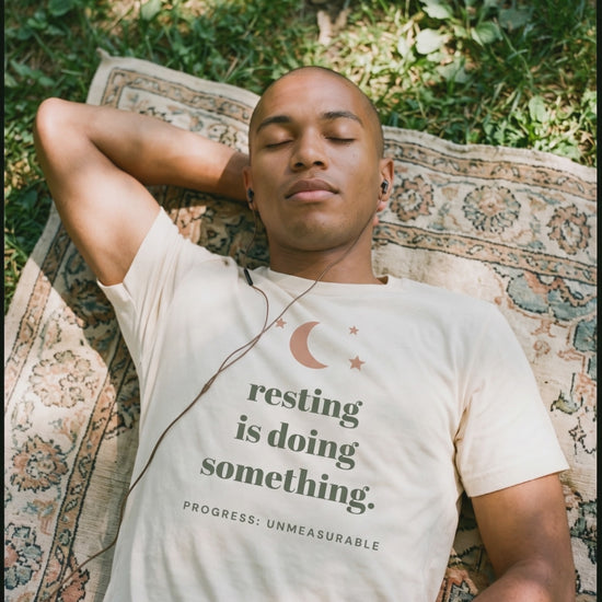 Resting Is Doing Something Tee, a short clip of lying on a blanket in the dappled sun