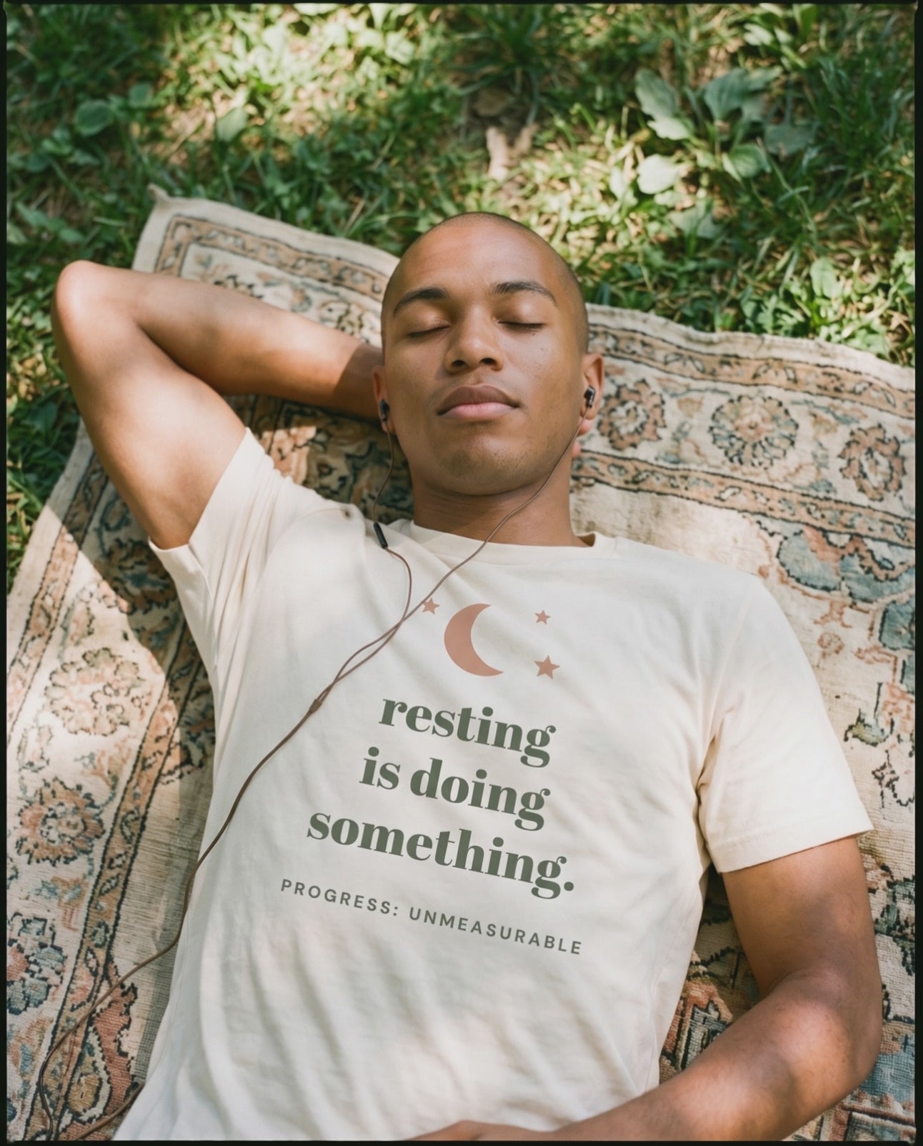 Resting Is Doing Something Tee, a short clip of lying on a blanket in the dappled sun
