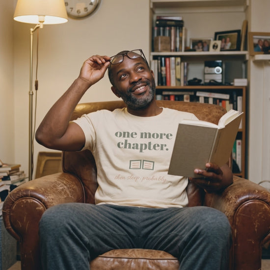 One More Chapter Tee, a short clip of turning a page in a leather armchair