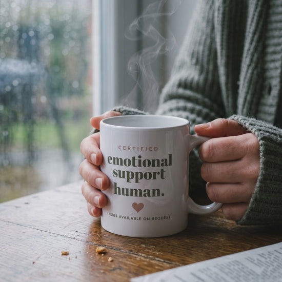 Emotional Support Human Mug, a short clip of hands around the mug by a rainy window