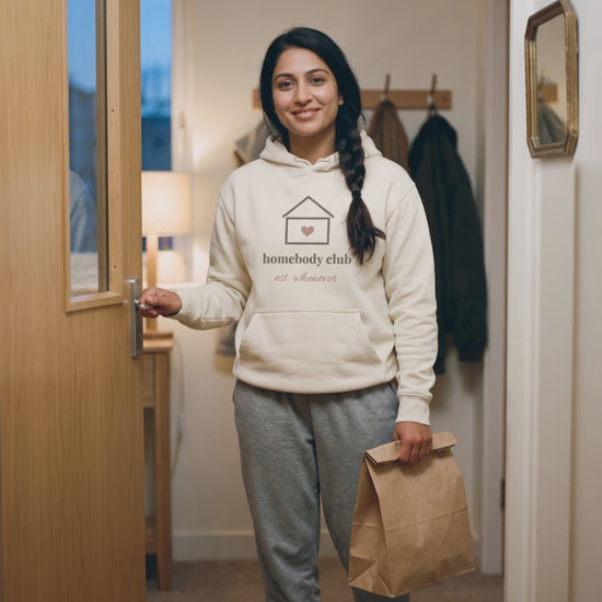 Homebody Club Hoodie, a short clip of coming home through the front door with a takeaway bag