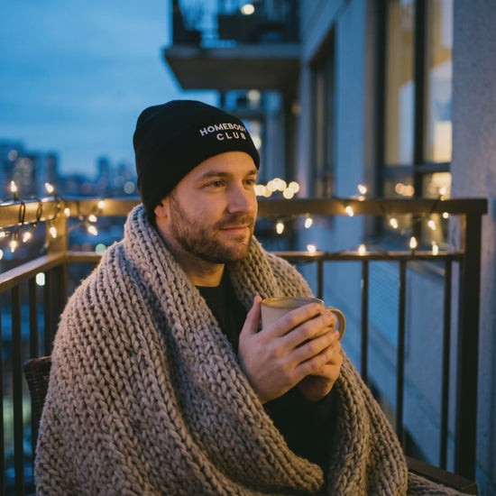 Homebody Club Beanie, a short clip of a warm drink on a balcony at dusk