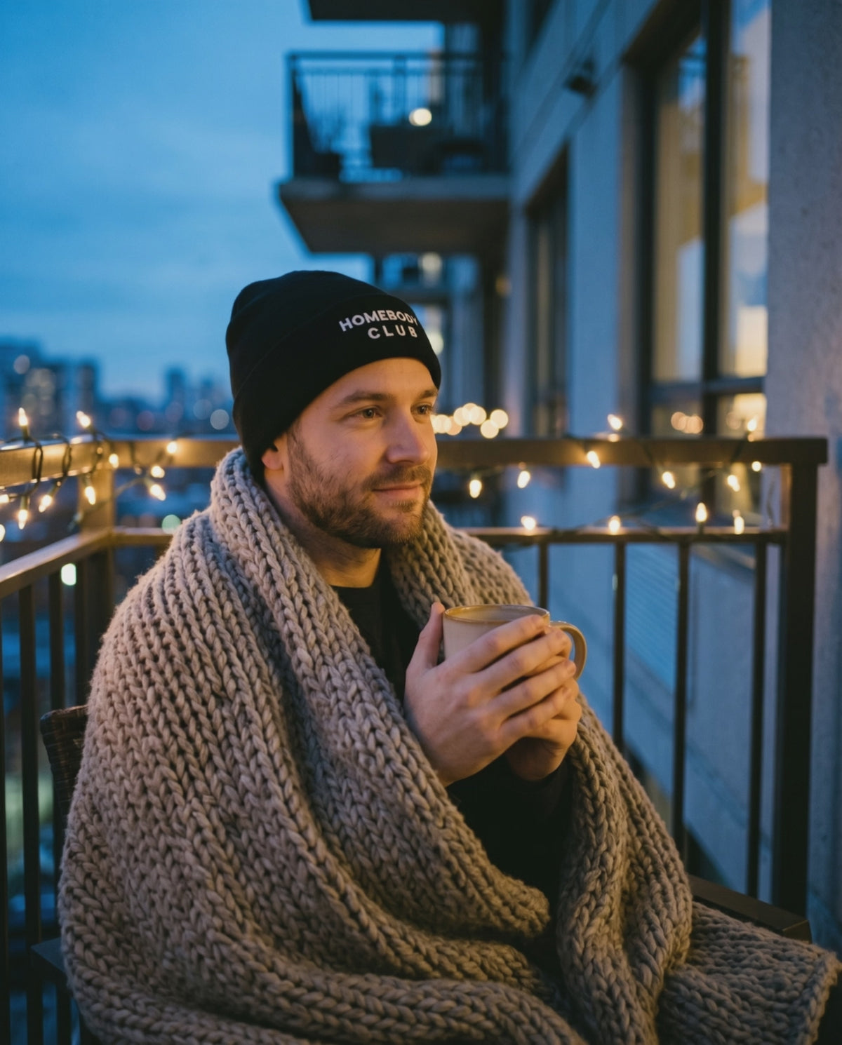 Homebody Club Beanie, a short clip of a warm drink on a balcony at dusk