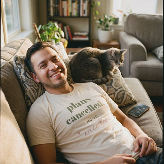 Plans Cancelled Tee, a short clip of lying back on the sofa with a sleeping cat