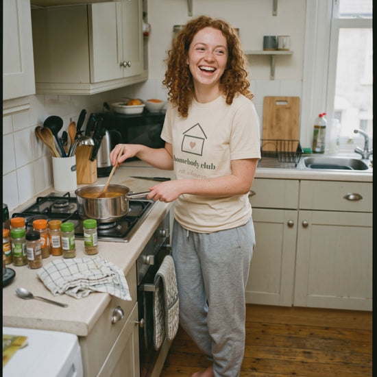 Homebody Club Tee, a short clip of stirring a pot of soup at home