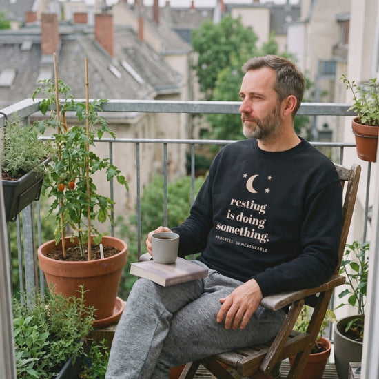 Resting Is Doing Something Crewneck, a short clip of a quiet moment in the sun on a balcony