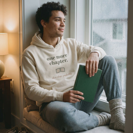 One More Chapter Hoodie, a short clip of opening a book on a window seat on a rainy day