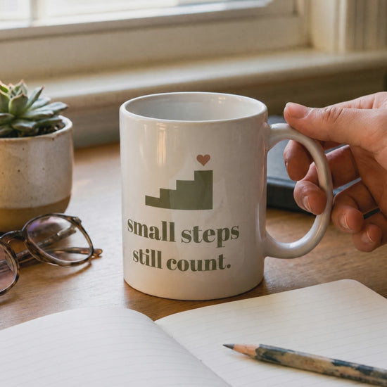 Small Steps Still Count Mug, a short clip of steam and morning light on a desk