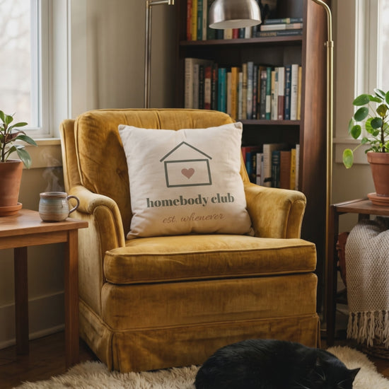 Homebody Club Pillow, a short clip of a quiet reading nook with a sleeping cat