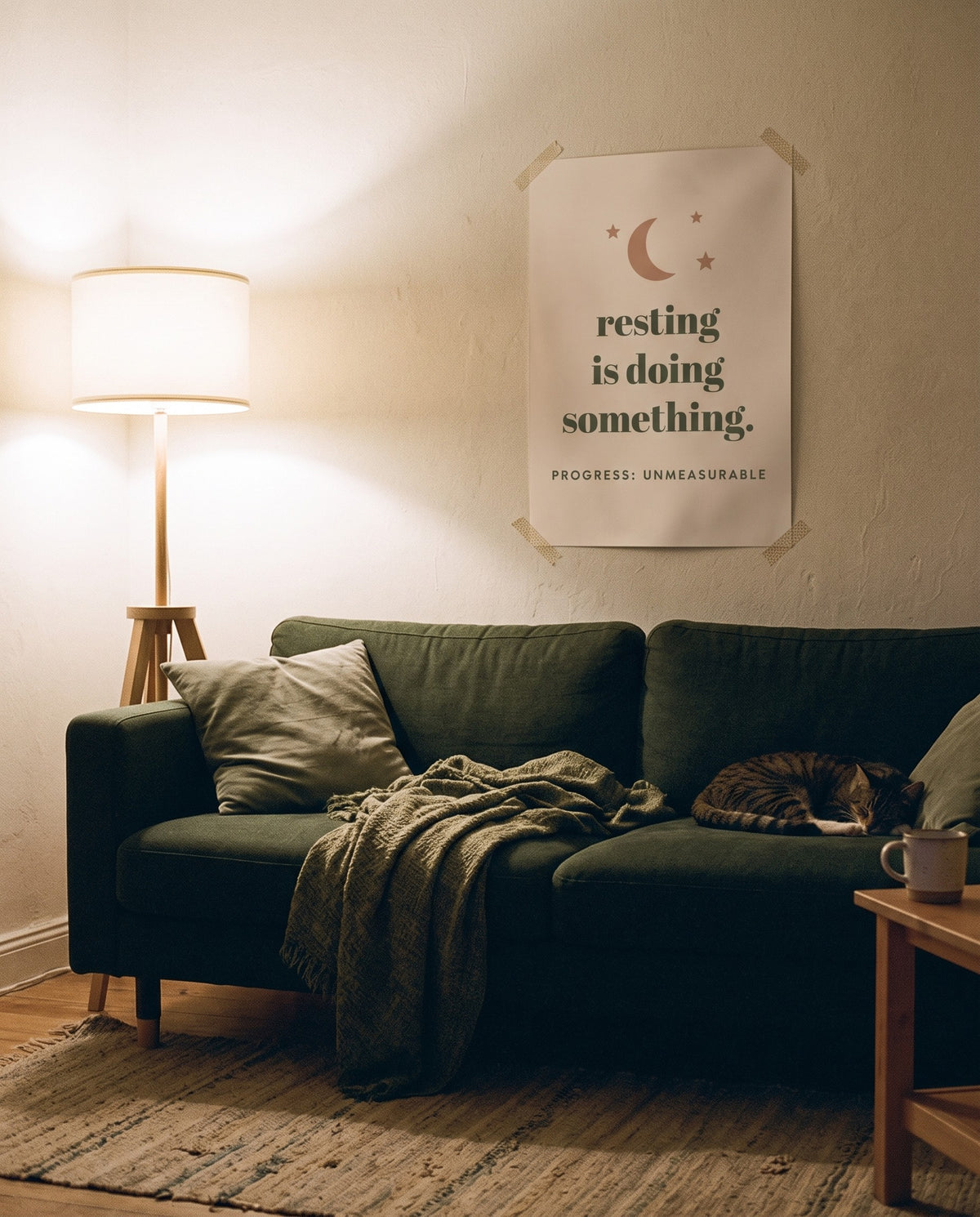 Resting Is Doing Something Print, unframed, taped above a sofa
