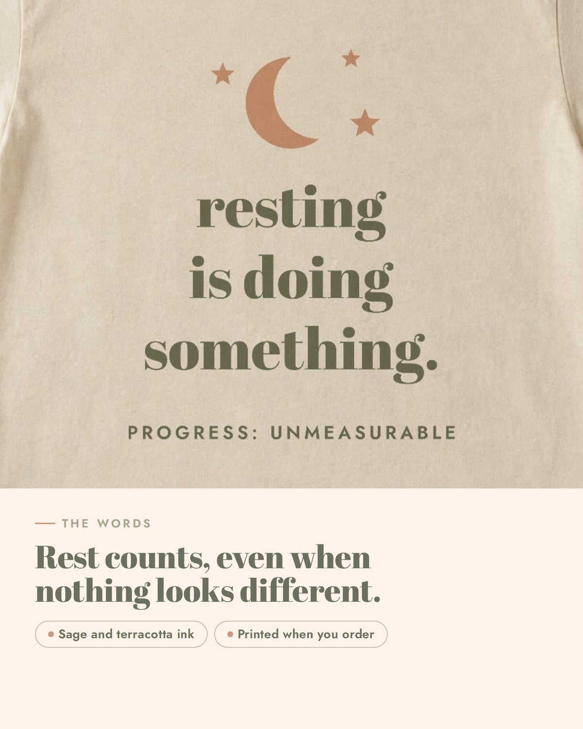 Resting Is Doing Something Tee, the words up close, sage and terracotta ink on soft cream cotton