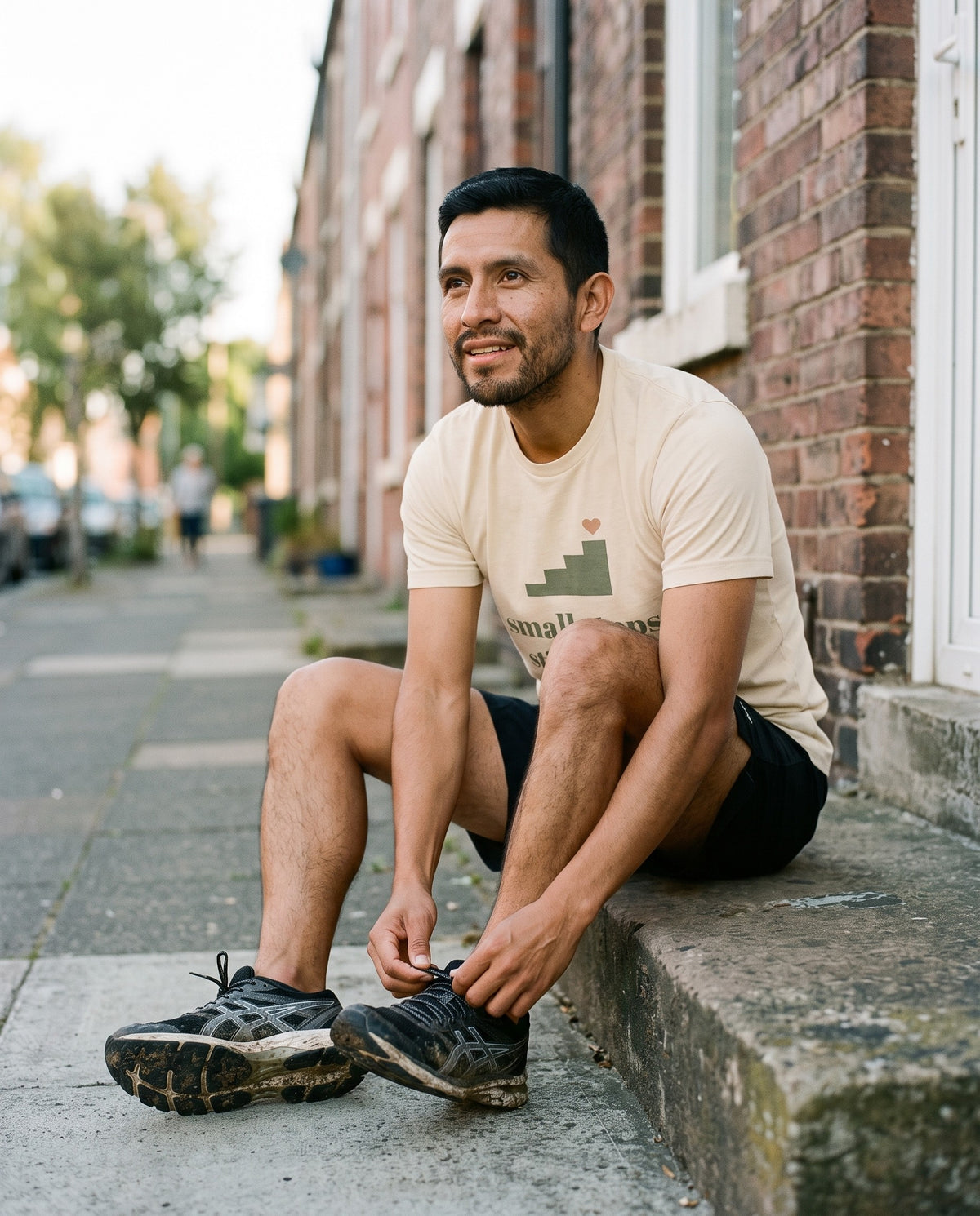 Small Steps Still Count Tee, worn tying running shoes on the doorstep