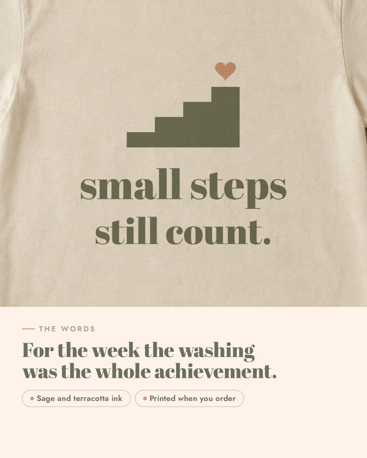 Small Steps Still Count Tee, the words up close, sage and terracotta ink on soft cream cotton