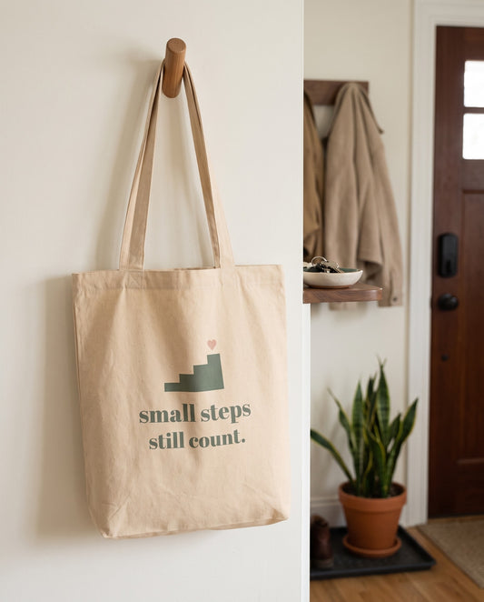 Small Steps Still Count Tote, hanging on a hallway peg