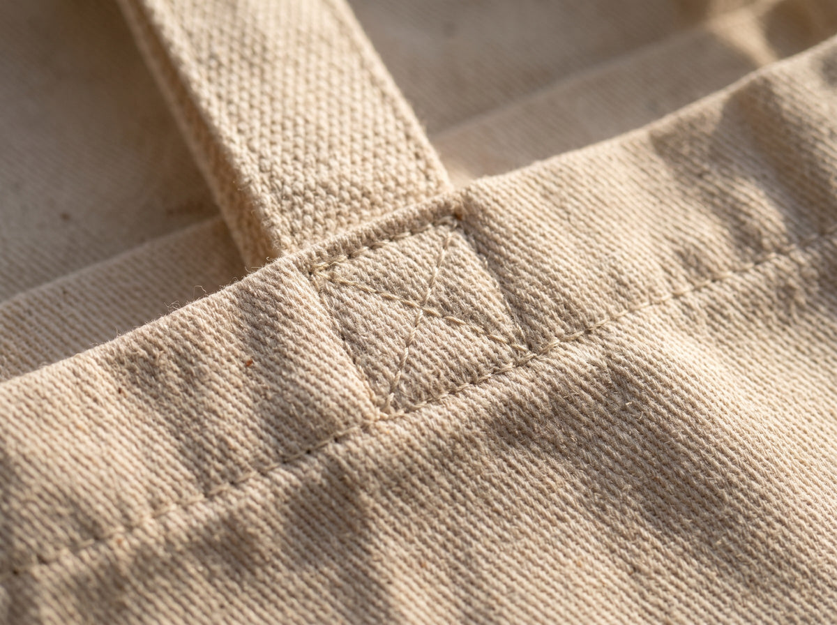 Small Steps Still Count Tote, close up of the strap stitching and the cotton twill weave
