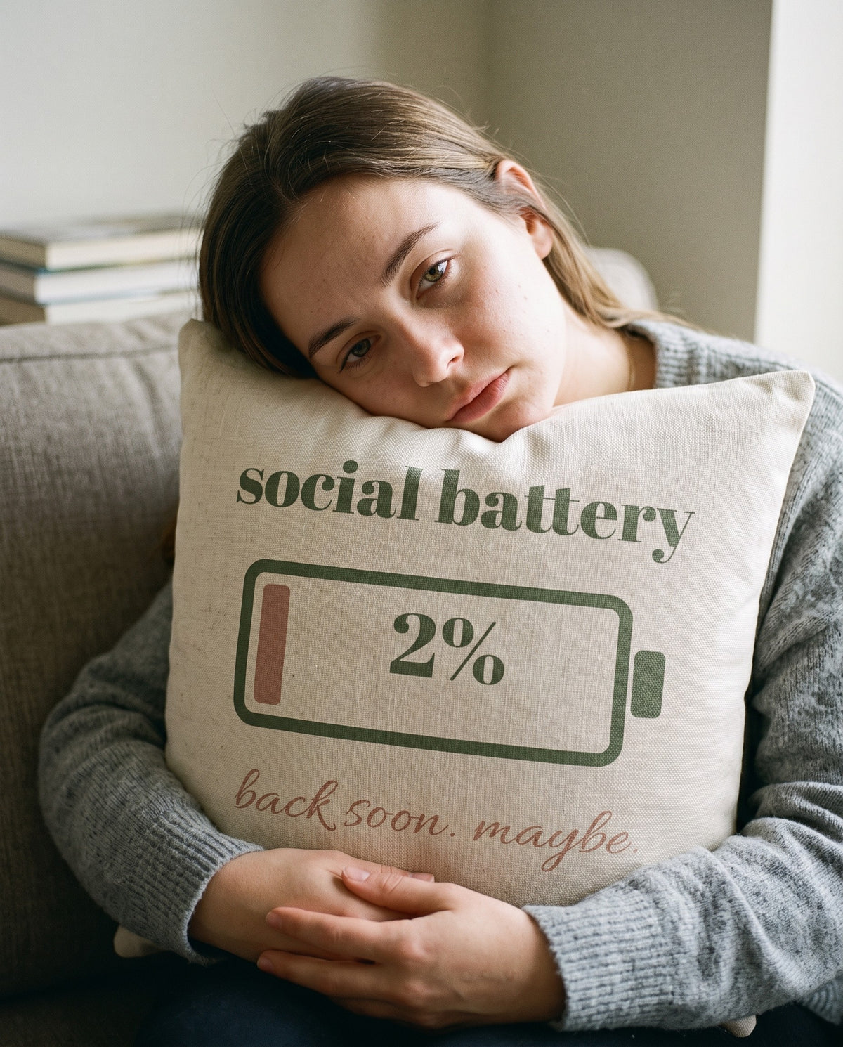Social Battery Pillow, hugged on the sofa