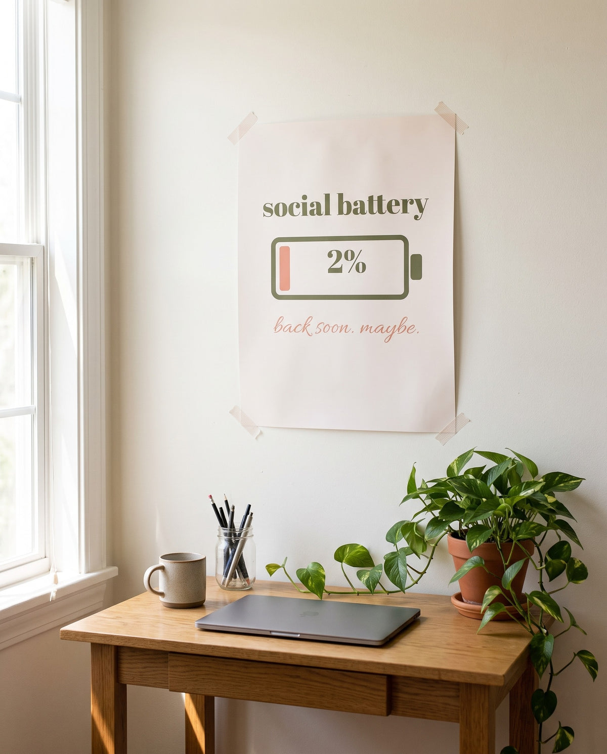 Social Battery Print, unframed, taped above a home desk