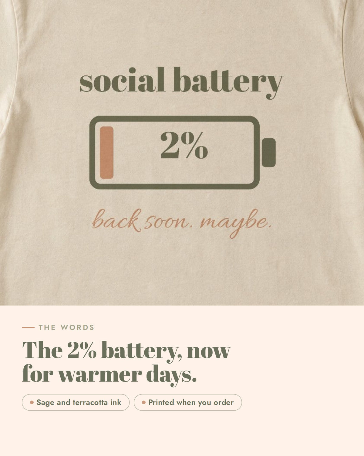 Social Battery Tee, the words up close, sage and terracotta ink on soft cream cotton
