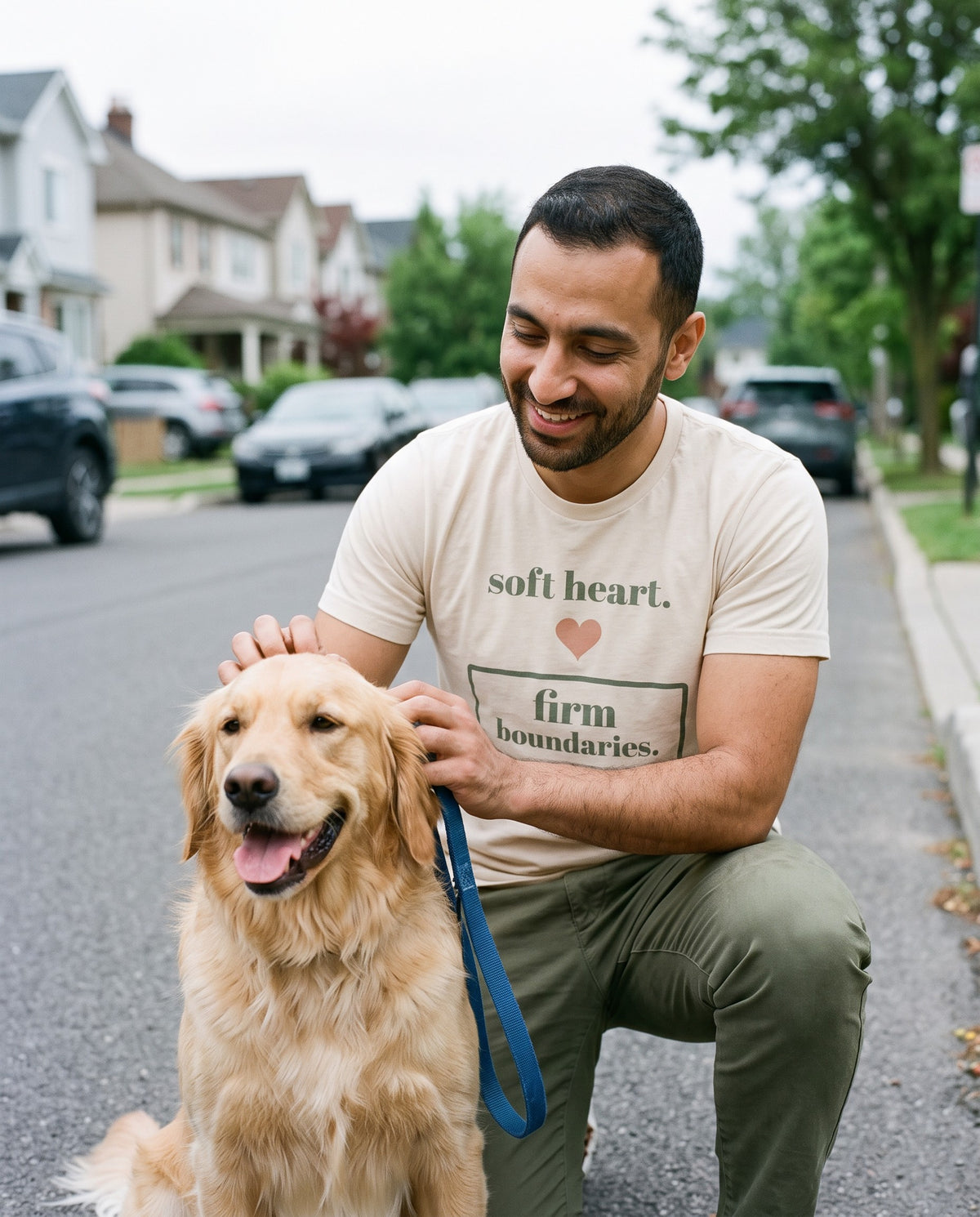 Soft Heart, Firm Boundaries Tee, worn on a walk with a golden retriever