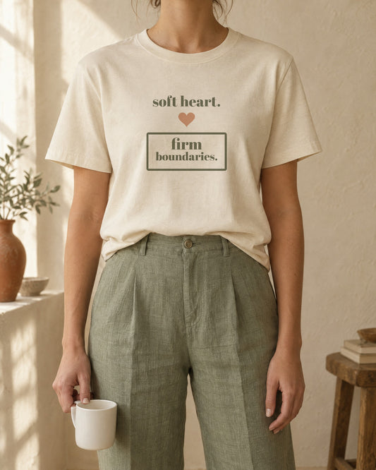 Soft Heart, Firm Boundaries Tee, in soft cream, worn with sage linen trousers