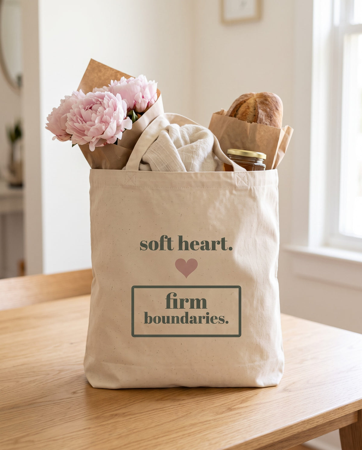 Soft Heart, Firm Boundaries Tote, packed with peonies, a linen scarf, bread and honey