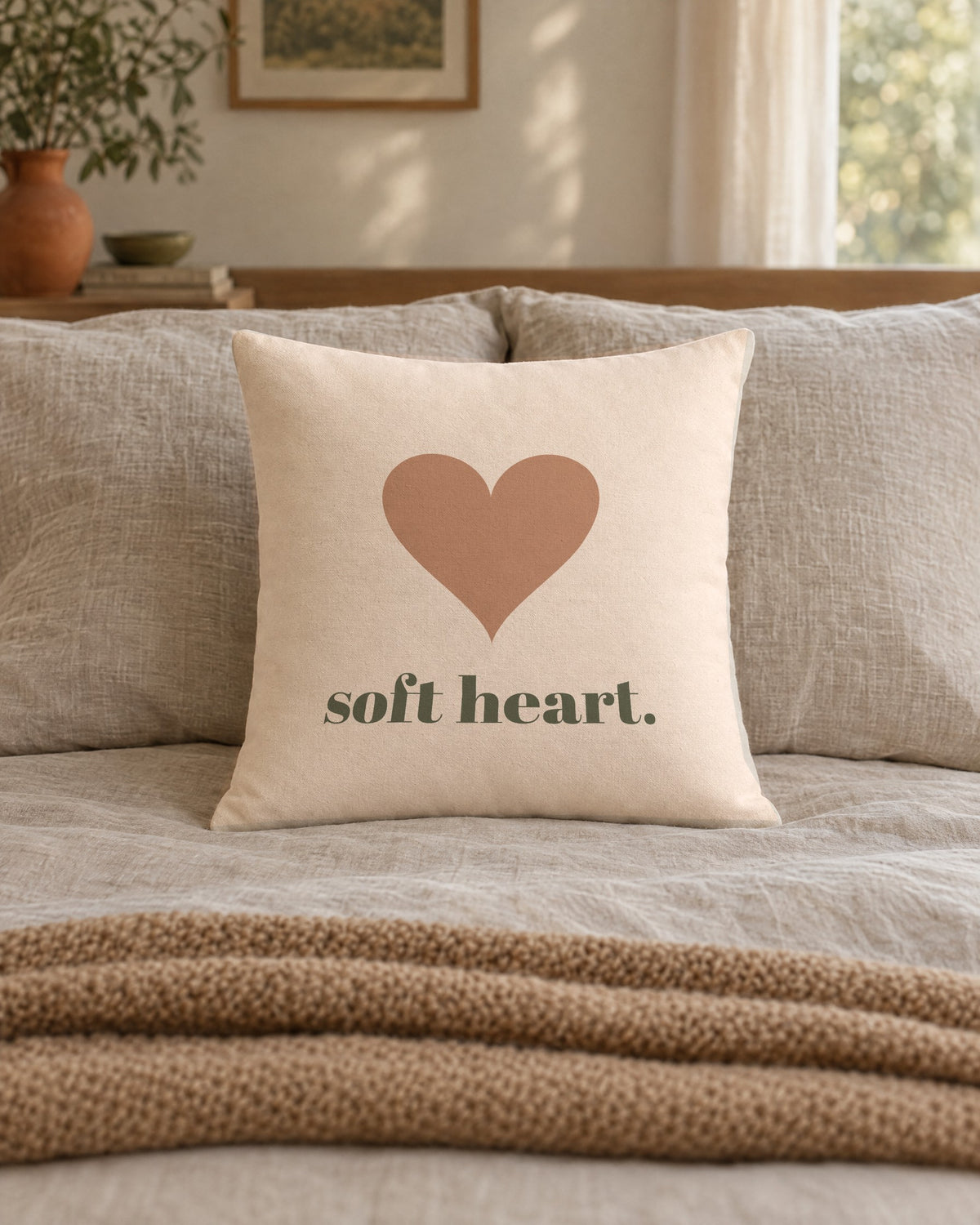 Soft Heart Pillow, 18 x 18 in, on a made bed