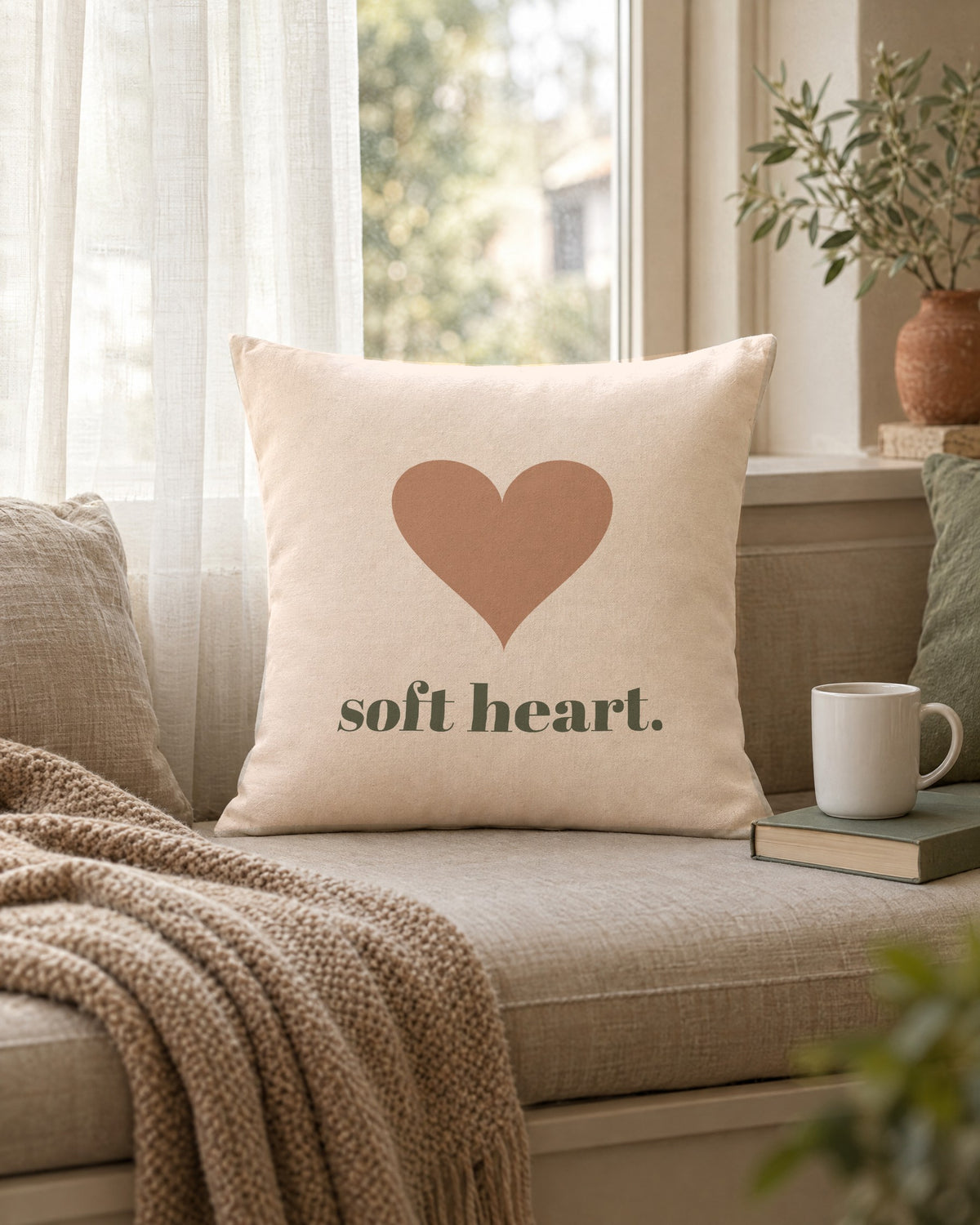 Soft Heart Pillow, 18 x 18 in, propped on a window seat