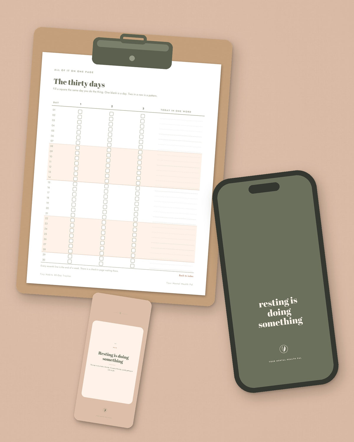 The thirty days page of the tracker on a clipboard, a lock screen on a phone and a printed pep-talk card