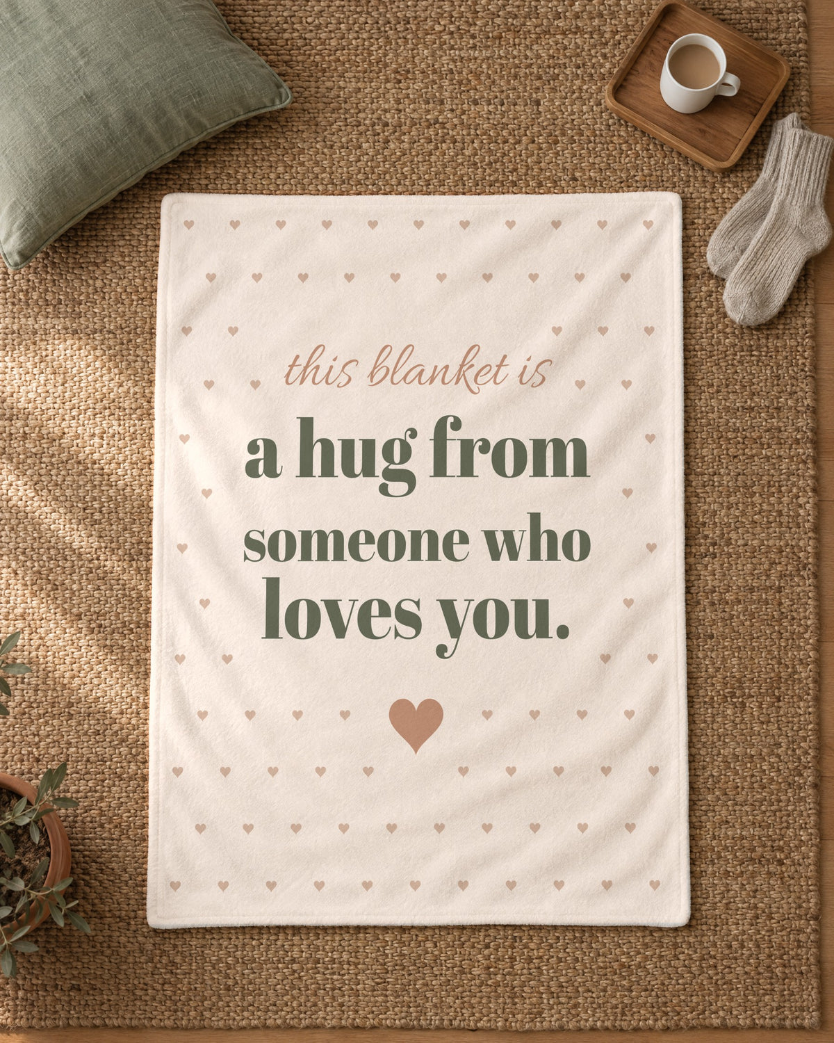 This Blanket Is a Hug Throw, 50 x 60 in, laid flat on a rug