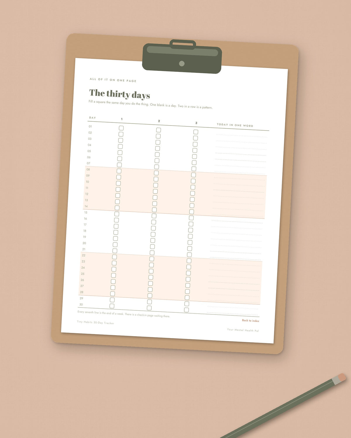 The thirty days page of the Tiny Habits tracker printed and clipped to a clipboard, with a pencil beside it
