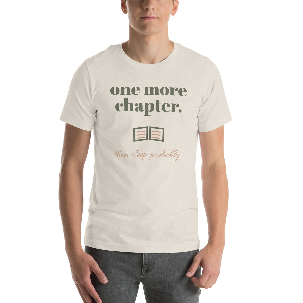 One More Chapter Tee in Heather Dust, worn by a model, front print: one more chapter, an open book, then sleep, probably