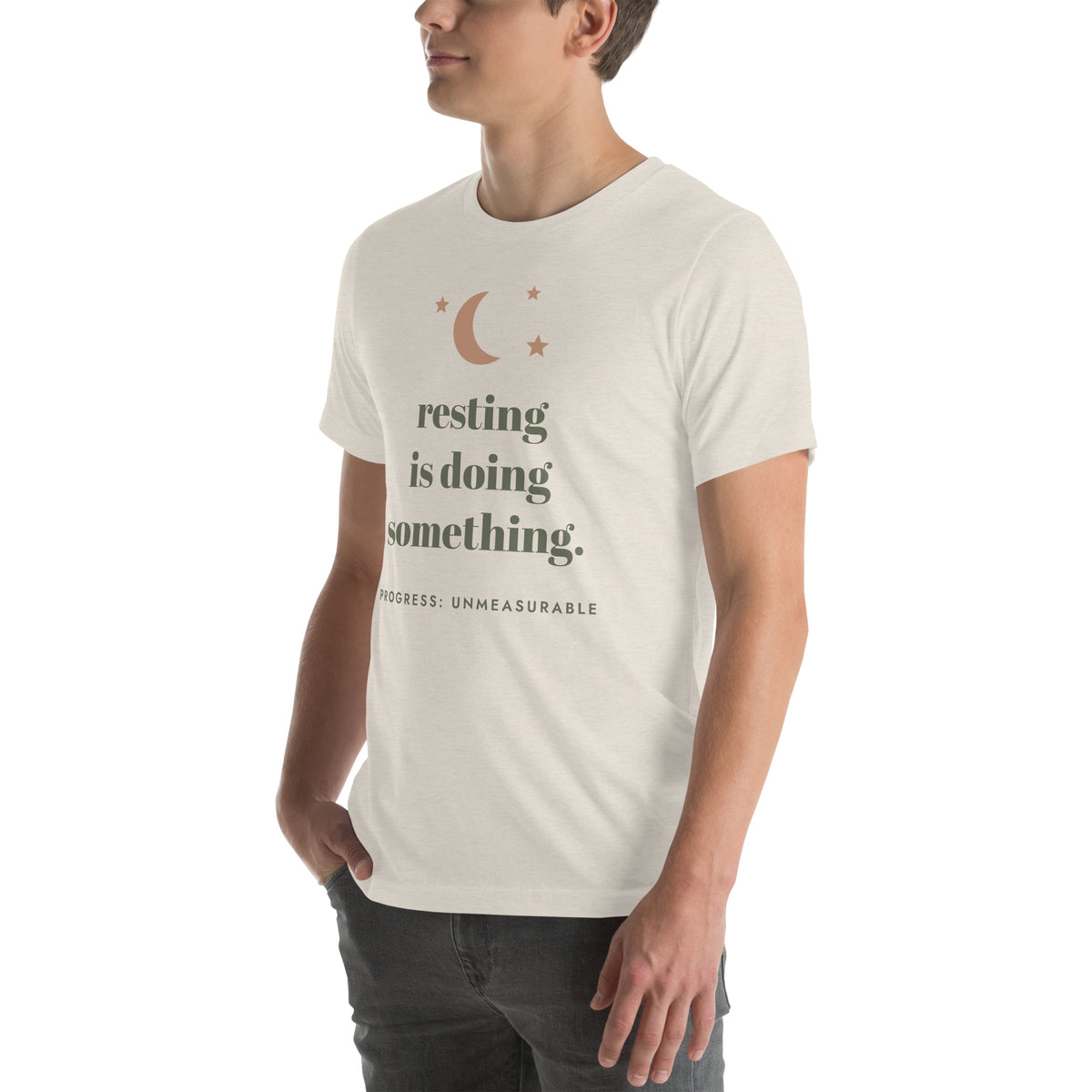 Resting Is Doing Something Tee in Heather Dust, worn by a model, three-quarter view from the left