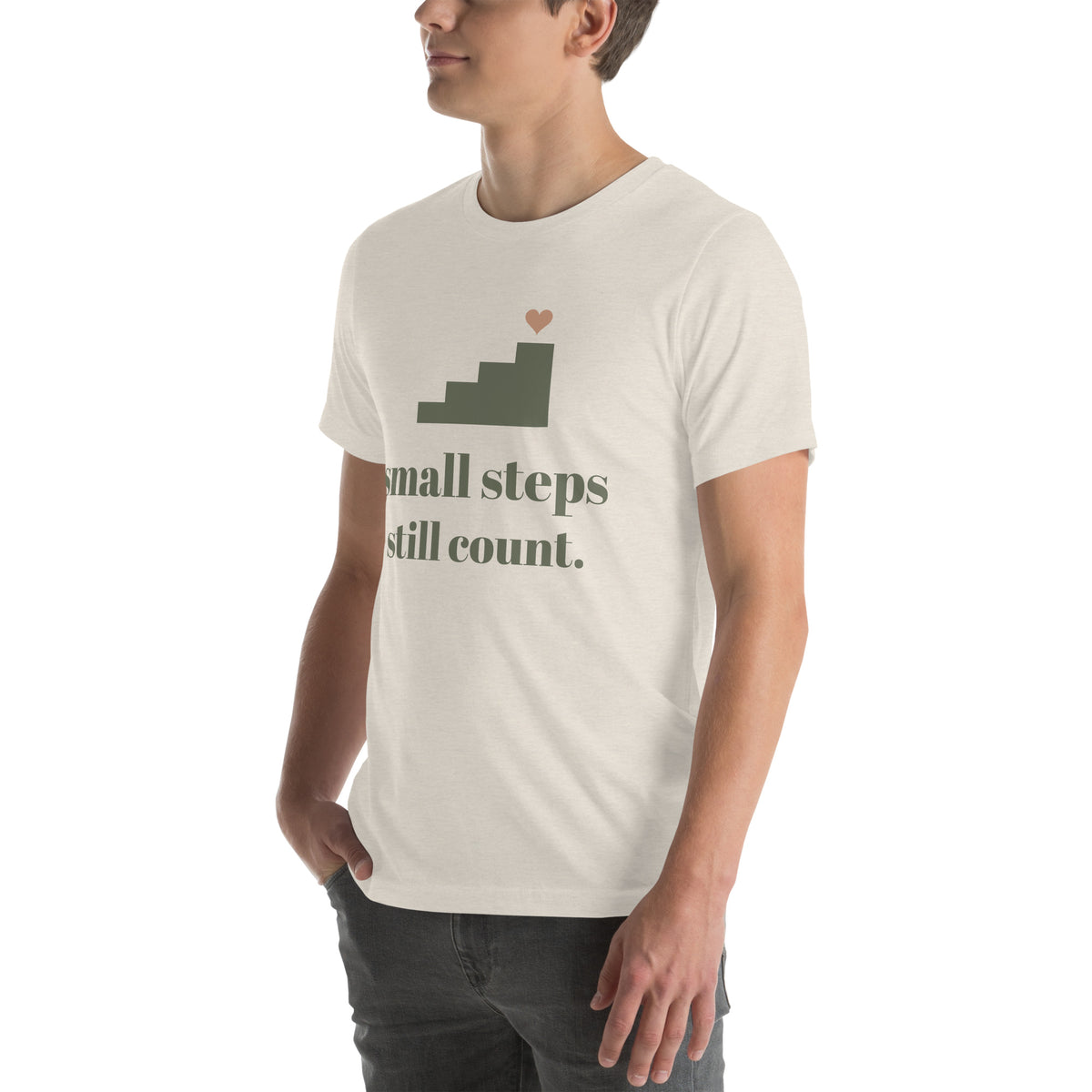 Small Steps Still Count Tee in Heather Dust, worn by a model, three-quarter view from the left