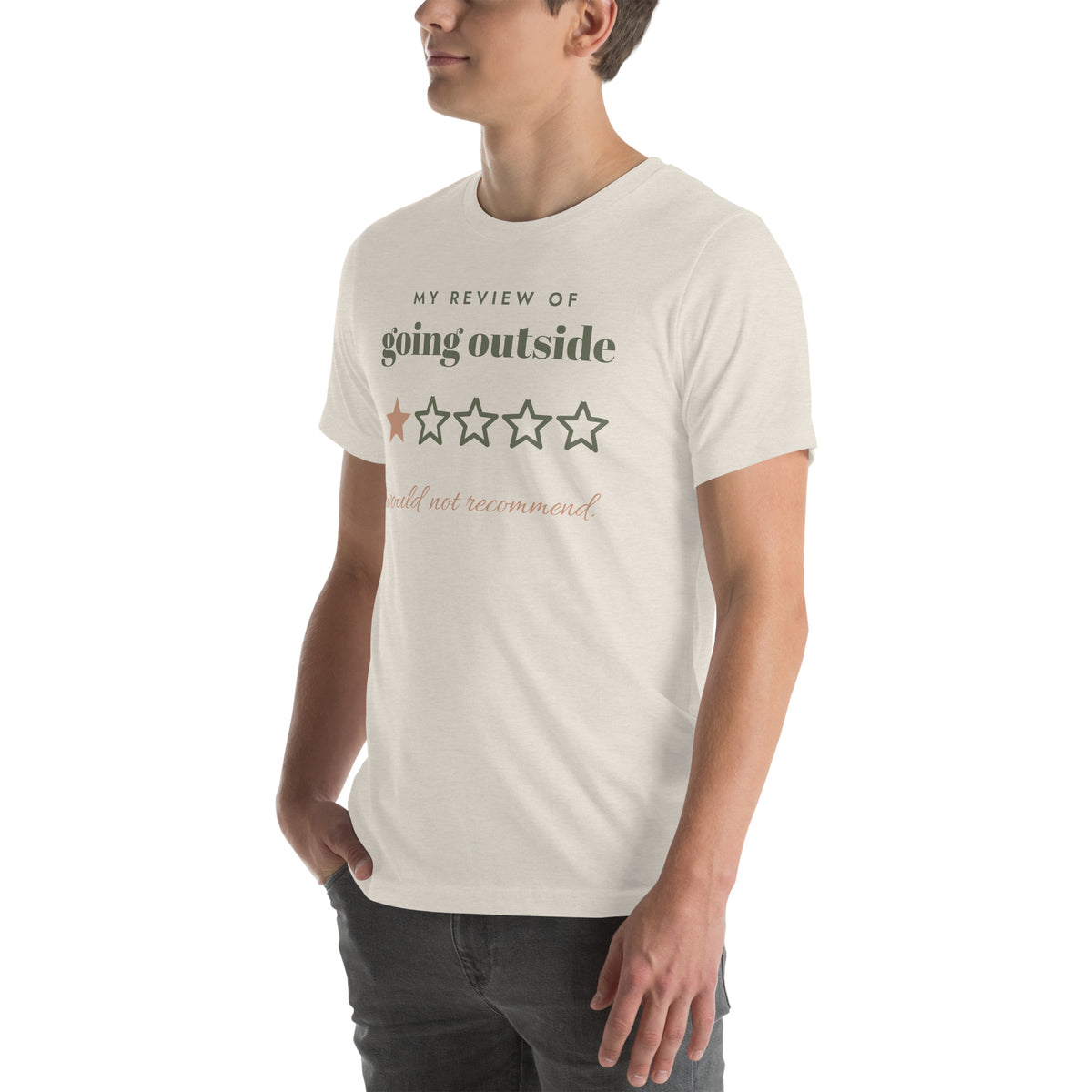 Going Outside, One Star Tee in Heather Dust, worn by a model, three-quarter view from the left