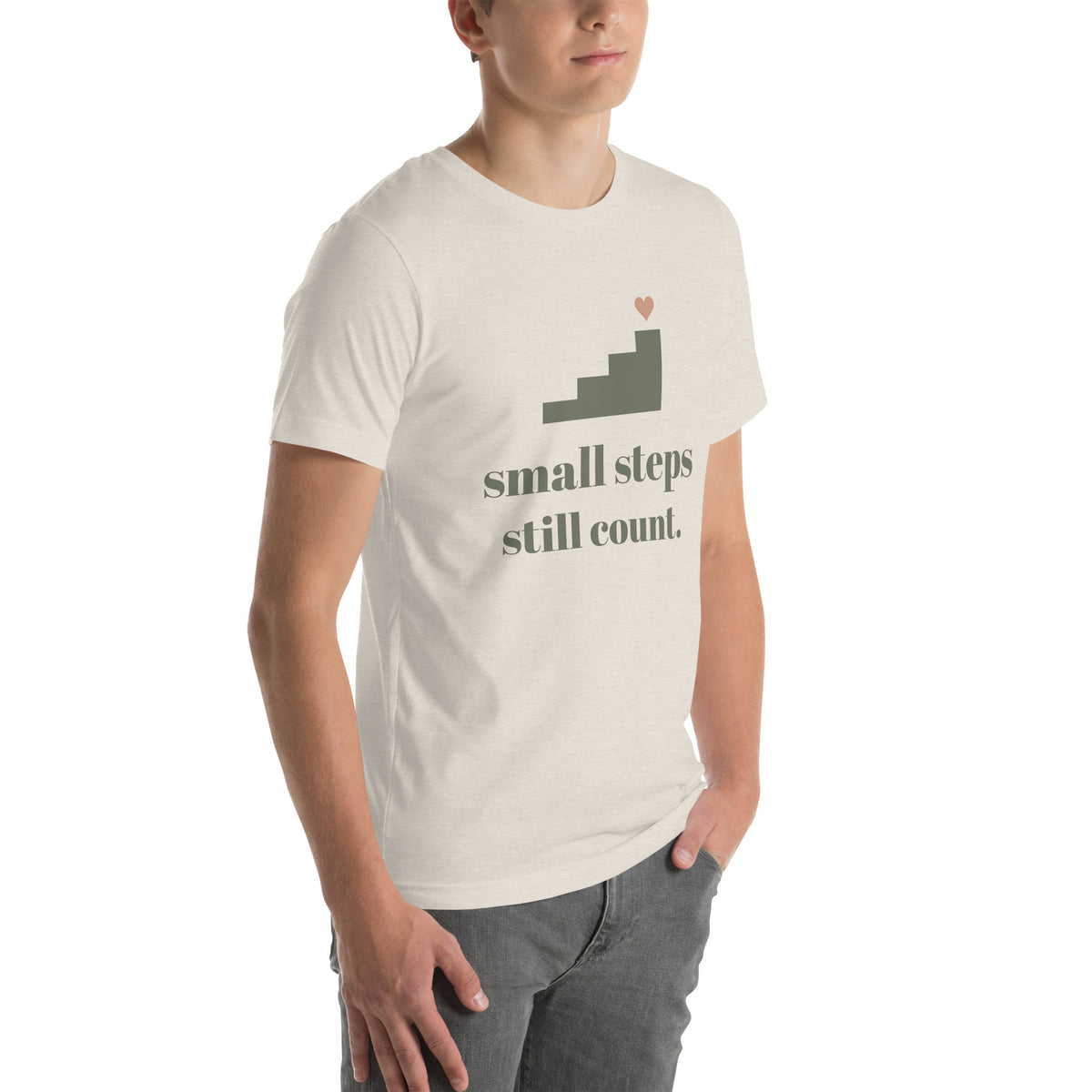 Small Steps Still Count Tee in Heather Dust, worn by a model, three-quarter view from the right