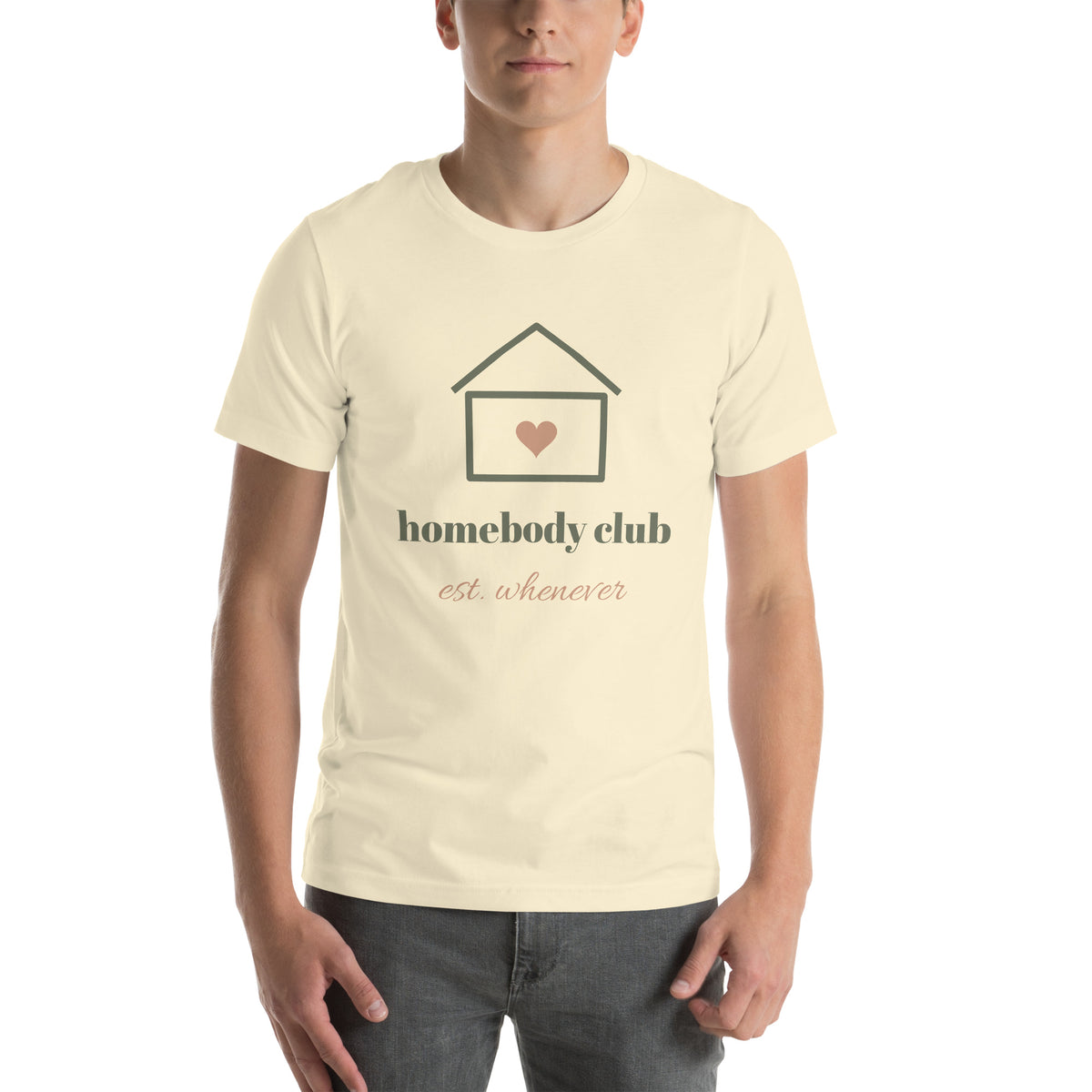 Homebody Club Tee in Natural, worn by a model, front print: a small house with a heart, homebody club, est. whenever
