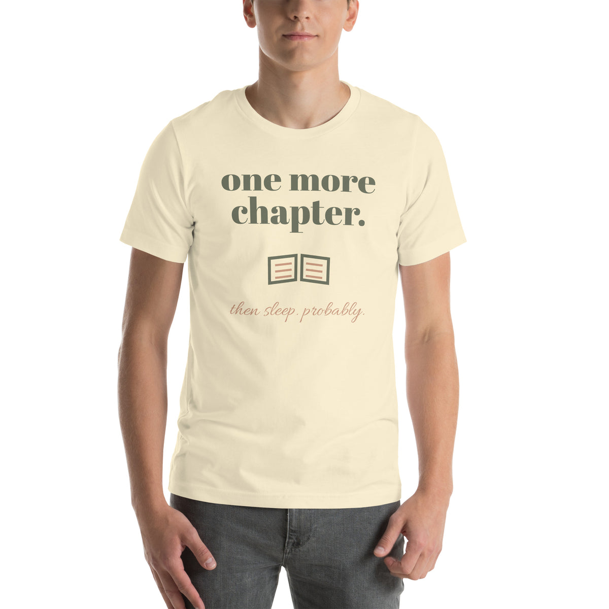 One More Chapter Tee in Natural, worn by a model, front print: one more chapter, an open book, then sleep, probably