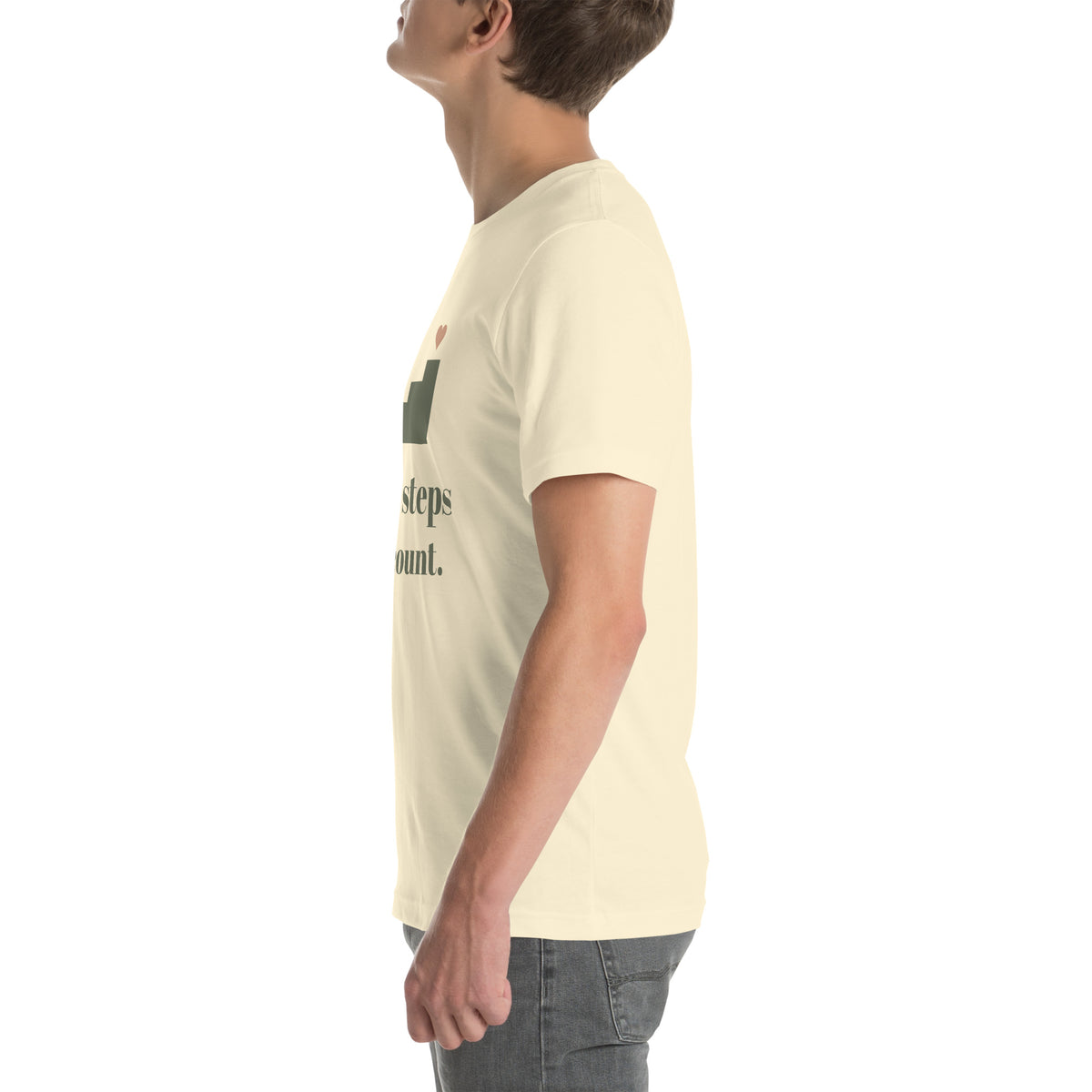 Small Steps Still Count Tee in Natural, worn by a model, left side