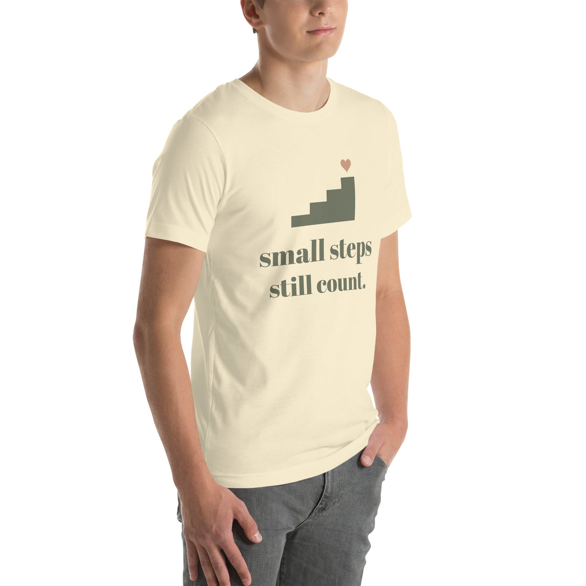 Small Steps Still Count Tee in Natural, worn by a model, three-quarter view from the right